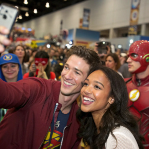 Grant Gustin and Candice Patton at Comic-Con. The bustling event with numerous attendees in costumes.