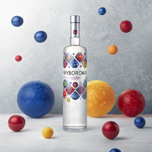 Digital ad for Wyborowa vodka. Modern design with vibrant colors and sleek style. Vodka bottle showcased among colorful, spherical shapes and a textured background.