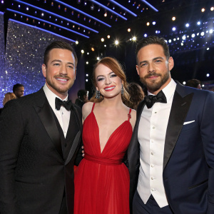 Jimmy Kimmel, Emma Stone, Danny Amendola, and MUNA posing together at a glitzy awards ceremony.