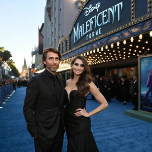 Sharlto Copley and Tanit Phoenix on the blue carpet. Disney's 'Maleficent' premiere at El Capitan Theatre.