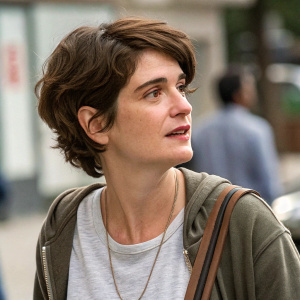 Gaby Hoffmann in a candid shot. Wearing a casual outfit, short brown hair, close-up